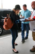 EMMA STONE Arrives at Los Angeles International Airport