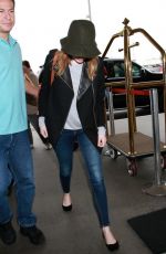 EMMA STONE Arrives at Los Angeles International Airport