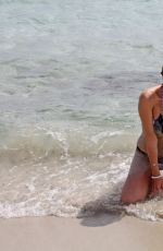 IMOGEN THOMAS in Bikini at the Beach in Italy