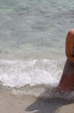 IMOGEN THOMAS in Bikini at the Beach in Italy