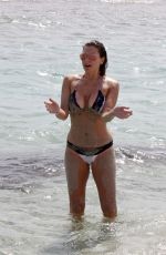 IMOGEN THOMAS in Bikini at the Beach in Italy