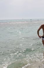 IMOGEN THOMAS in Bikini at the Beach in Italy