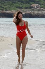 IMOGEN THOMAS in Swimsuit on the Beach in Spain