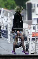 KATY PERRY Boarding at Ferry on the Thames River in London
