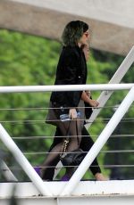 KATY PERRY Boarding at Ferry on the Thames River in London