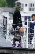 KATY PERRY Boarding at Ferry on the Thames River in London