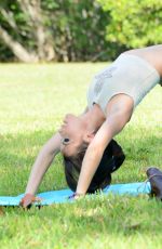 LISA OPIE in Bikini Bottoms Doing Yoga at a Park in Miami