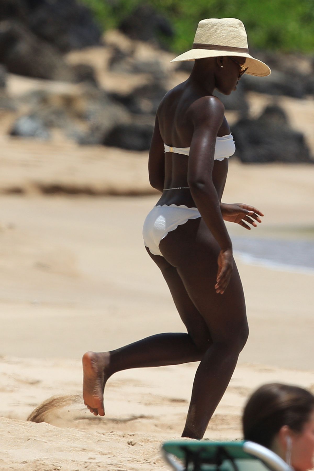 LUPITA NYONG’O in Bikini at a Beach i Haeaii.