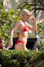 MILEY CYRUS in Bikini at a Hotel Pool in Barcelona