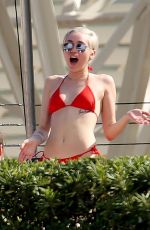 MILEY CYRUS in Bikini at a Hotel Pool in Barcelona