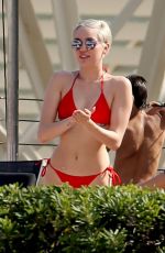 MILEY CYRUS in Bikini at a Hotel Pool in Barcelona
