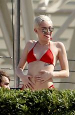 MILEY CYRUS in Bikini at a Hotel Pool in Barcelona