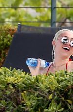 MILEY CYRUS in Bikini at a Hotel Pool in Barcelona