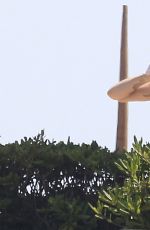 MILEY CYRUS in Bikini Top at a Pool in Barcelona