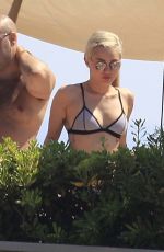 MILEY CYRUS in Bikini Top at a Pool in Barcelona