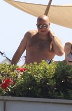 MILEY CYRUS in Bikini Top at a Pool in Barcelona