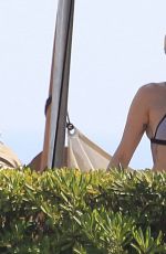 MILEY CYRUS in Bikini Top at a Pool in Barcelona