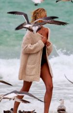 CANDICE SWANEPOEL at a Photoshoot at a Beach