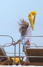CARA DELEVINGNE in Bikini Celebrates Selena Gomez
