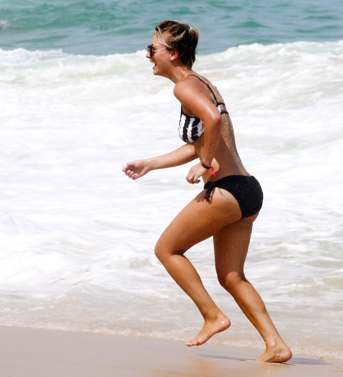 KALEY CUOCO in Bikini on the Beach in Cabo.