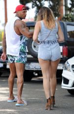 KELLY BROOK in Shorts Rides a Bike Out in Venice Beach