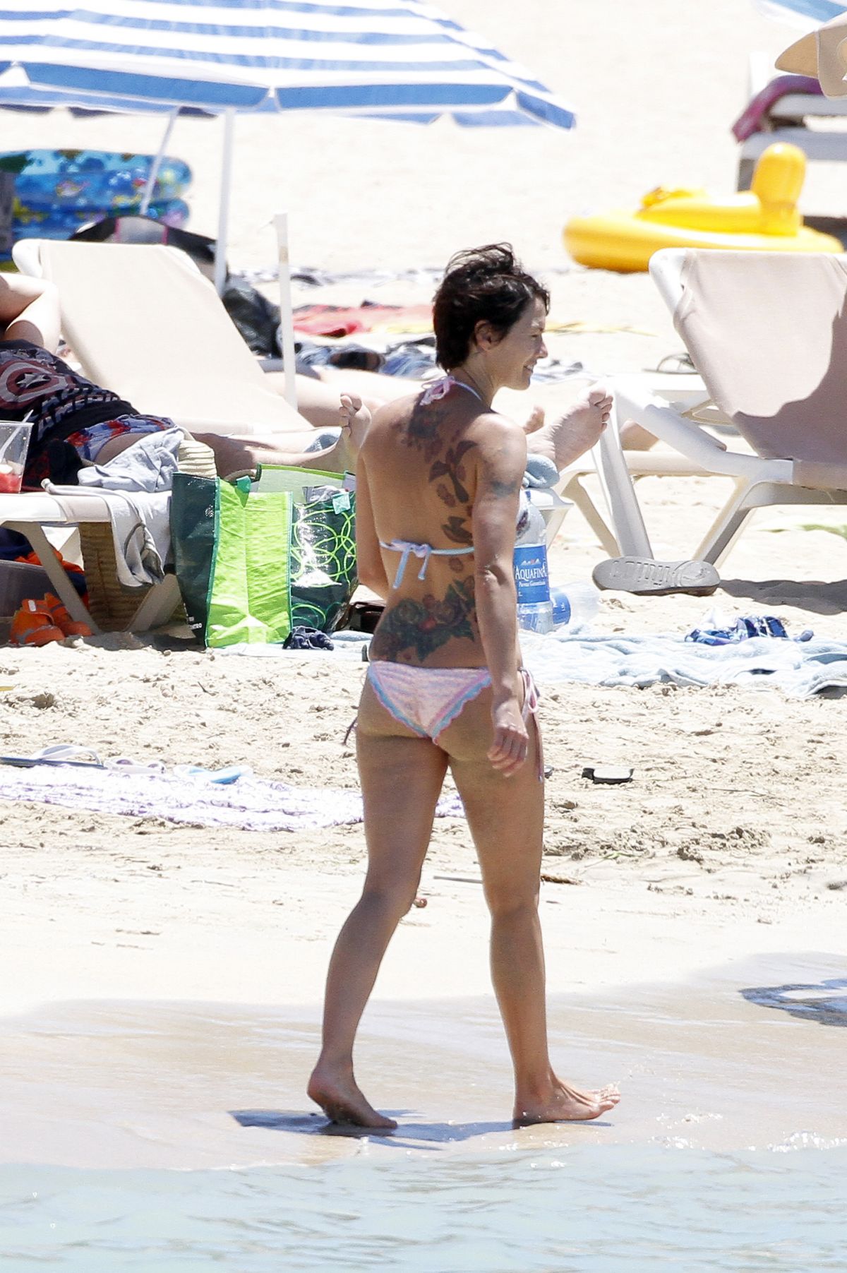 LENA HEADEY in Bikini at a Beach in Ibiza.