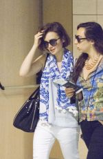 LILY COLLINS at Airport in Ibiza