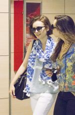 LILY COLLINS at Airport in Ibiza
