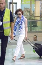 LILY COLLINS at Airport in Ibiza