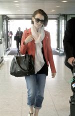 LILY COLLINS at Heathrow Airport in London