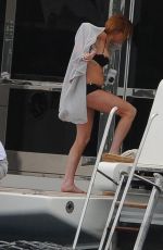 LINDSAY LOHAN in Bikini in a Boat at Ischia