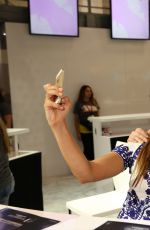 NINA DOBREV at Warner Bros Signing Booth at Comic-con