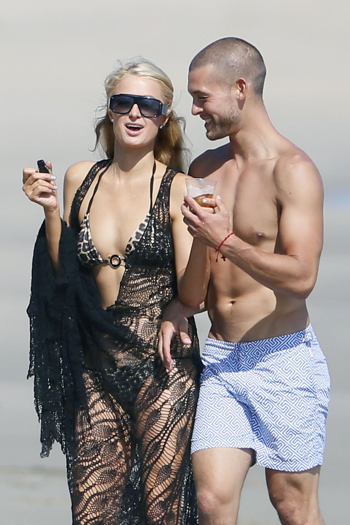 PARIS HILTON in Bikini at a Beach in Malibu PARIS HILTON in Bikini at a Beach in Malibu