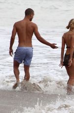 PARIS HILTON in Swimsuit and Her New Boyfriend at a Beach in Malibu