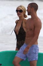 PARIS HILTON in Swimsuit and Her New Boyfriend at a Beach in Malibu