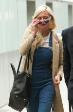 KIRSTEN DUNST at Heathrow Airport in London