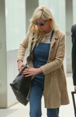 KIRSTEN DUNST at Heathrow Airport in London