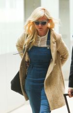 KIRSTEN DUNST at Heathrow Airport in London