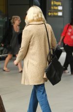 KIRSTEN DUNST at Heathrow Airport in London