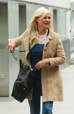 KIRSTEN DUNST at Heathrow Airport in London