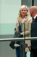 KIRSTEN DUNST at Heathrow Airport in London
