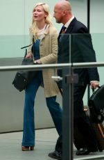 KIRSTEN DUNST at Heathrow Airport in London