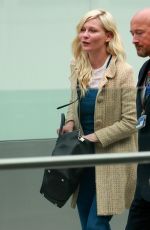 KIRSTEN DUNST at Heathrow Airport in London