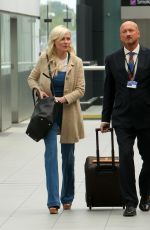 KIRSTEN DUNST at Heathrow Airport in London