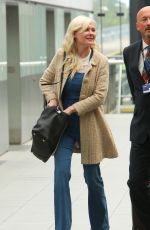 KIRSTEN DUNST at Heathrow Airport in London