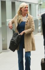 KIRSTEN DUNST at Heathrow Airport in London