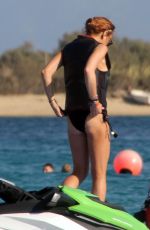 LINDSAY LOHAN in Bikini Jetskiing in Greece