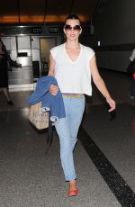 MILLA JOVOVICH Arrives at LAX Airport