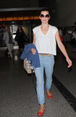 MILLA JOVOVICH Arrives at LAX Airport