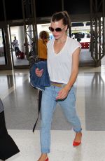 MILLA JOVOVICH Arrives at LAX Airport